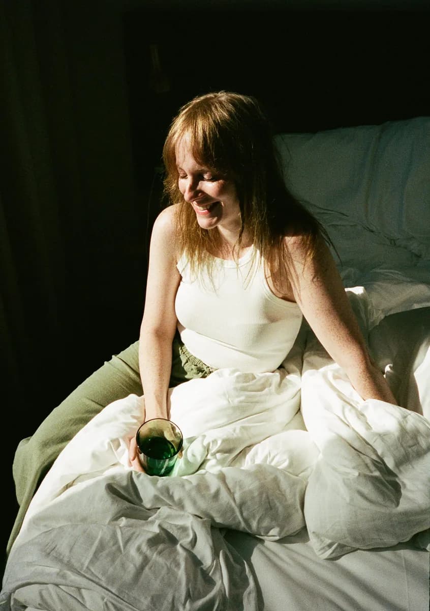 A woman resting in warm morning light